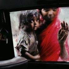 Mother and Child at Car Window, Bombay, India, 1993. © Steve McCurry